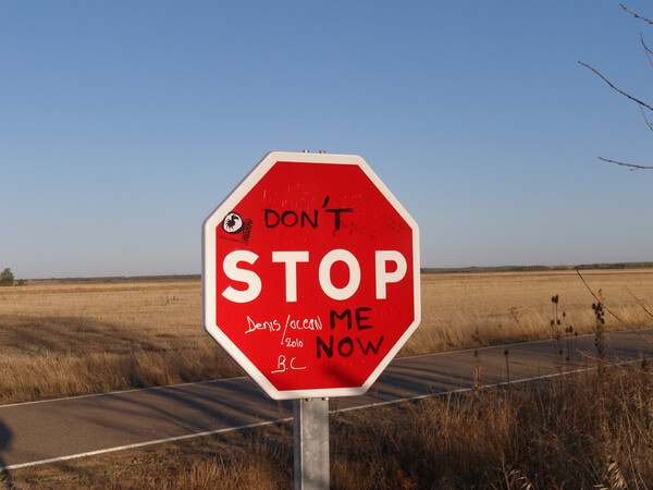 Playful Graffiti Interrupts Stop Sign Picture Board by Roger Mechan