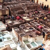Buy canvas prints of An Immersive Experience in Fez's Leather Tanneries by Roger Mechan