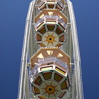 Buy canvas prints of Mesmerizing Fairground Ferris Wheel by Roger Mechan