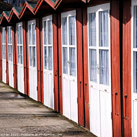 Buy canvas prints of Cheerful Huts by the Seashore by Roger Mechan