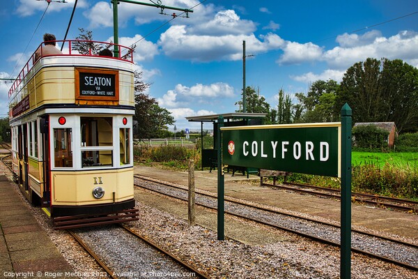Electric Tram Arriving at Colyford Station Picture Board by Roger Mechan