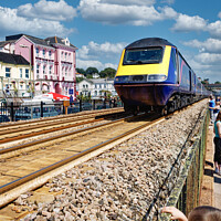 Buy canvas prints of Thundering Train in Dawlish by Roger Mechan