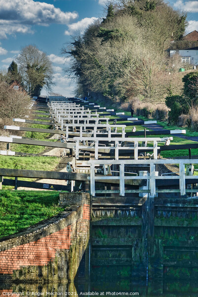 Ascending the Caen Hill Locks Picture Board by Roger Mechan
