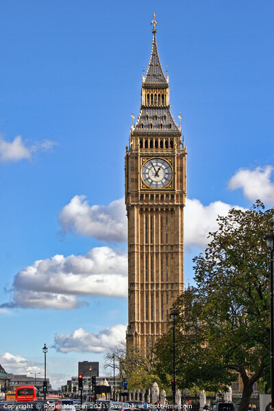 Iconic Clock Tower amidst Bustling London Traffic Picture Board by Roger Mechan