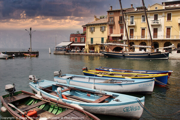 Serene Beauty: The Harbour at Malcesine Lake Garda Picture Board by Roger Mechan