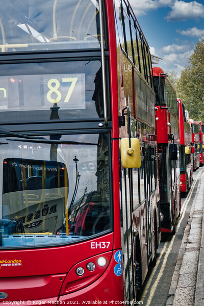 Endless Stream of Iconic Red Buses Picture Board by Roger Mechan