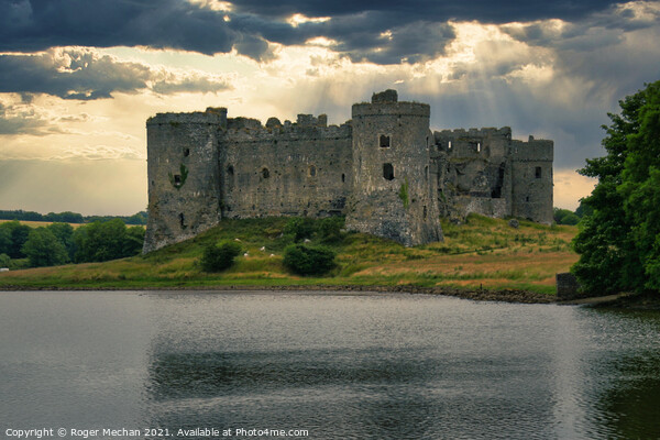 Threatening Skies over Carew Castle Picture Board by Roger Mechan