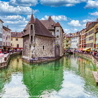 Buy canvas prints of Annecy's Colorful Canal by Roger Mechan