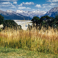 Buy canvas prints of Snowcapped Mountains in Arthurs Pass by Roger Mechan