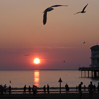 Buy canvas prints of Sun setting over Weston Super Mare by Charlotte Noble
