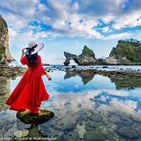 Buy canvas prints of Woman standing on the rock at Atuh beach, Nusa penida island by Stan Lihai