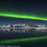 Buy canvas prints of Northern lights over Iceland mountain and lagoon by Giles Rocholl