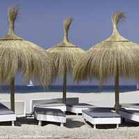 Buy canvas prints of Tarifa beach sun loungers Spain by Giles Rocholl