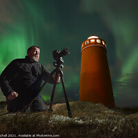 Buy canvas prints of Photographer light house and northern lights Iceland by Giles Rocholl