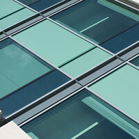 Buy canvas prints of Abstract glass and stone building by Giles Rocholl