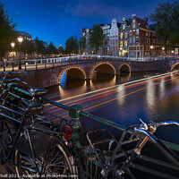 Buy canvas prints of Amsterdam Bicycles and Canals dusk by Giles Rocholl
