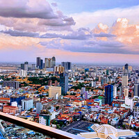 Buy canvas prints of The Phnom Penh skyline at dusk... by Arnaud Jacobs