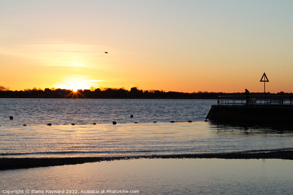 Sunset over Mersea Island from Brightlingsea beach Picture Board by Elaine Hayward