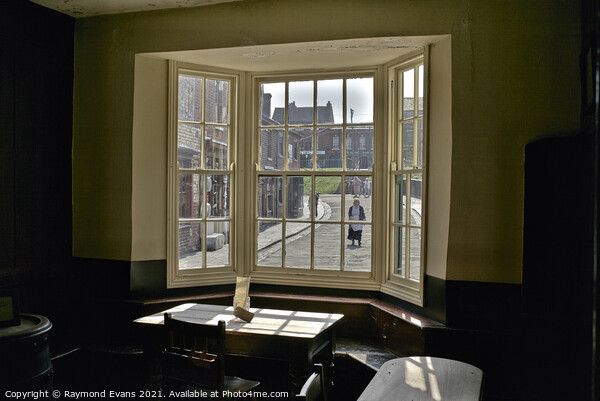 Through the window Framed Print by Raymond Evans