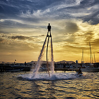 Buy canvas prints of Flyboarding by Raymond Evans