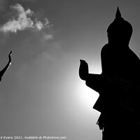 Buy canvas prints of Buddha statue Silhouette by Raymond Evans