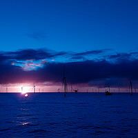 Buy canvas prints of Sunset in German windfarm by Russell Finney