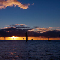 Buy canvas prints of Sunset in renewable windfarm by Russell Finney