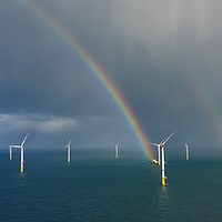 Buy canvas prints of Rainbows in the Windfarm by Russell Finney
