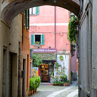 Buy canvas prints of Orta San Giulio Street Scene by Stuart Wyatt