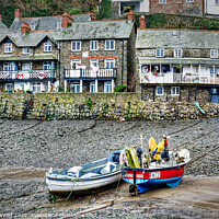 Buy canvas prints of Clovelly harbour-front cottages by Stuart Wyatt