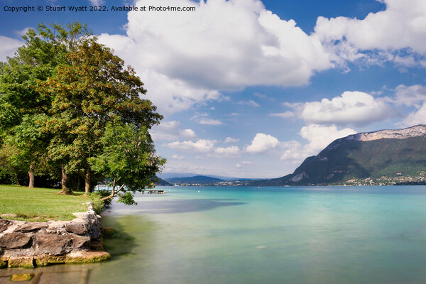 The emerald water of Lake Annecy Picture Board by Stuart Wyatt