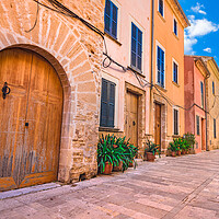 Buy canvas prints of Street with potted plants in Alcudia old town by Alex Winter