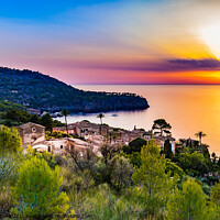 Buy canvas prints of Old mediterranean village with sunset sky by Alex Winter