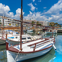 Buy canvas prints of Boats at harbour port of Cala Bona by Alex Winter