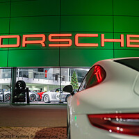 Buy canvas prints of Porsche car in front of Porsche store by Alex Winter
