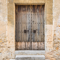 Buy canvas prints of Old grey wood door of vintage house by Alex Winter