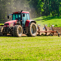 Buy canvas prints of Tractor plowing a field by Alex Winter