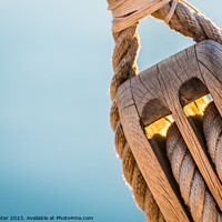 Buy canvas prints of Detail image of wooden pulley with ropes of an classical sailing yacht by Alex Winter
