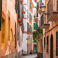 Buy canvas prints of Narrow street at the old town of Palma de Majorca by Alex Winter