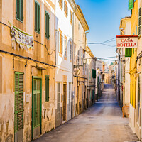 Buy canvas prints of Street view in Arta, rustic old town on Mallorca by Alex Winter
