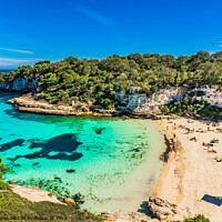 Buy canvas prints of Beautiful view of Cala Llombards beach bay by Alex Winter