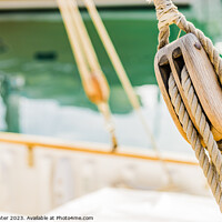 Buy canvas prints of Rustic Charm of a Wooden Sailboat Pulley by Alex Winter