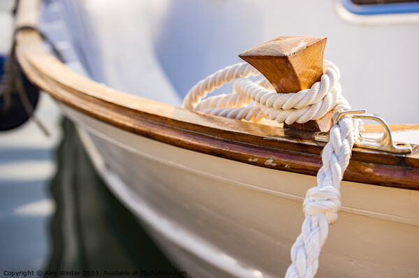 White mooring rope is knotted on boat cleat Picture Board by Alex Winter