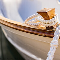Buy canvas prints of White mooring rope is knotted on boat cleat by Alex Winter