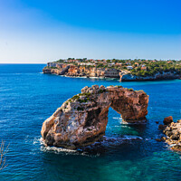Buy canvas prints of Rock arch at the coastline on Mallorca es pontas by Alex Winter