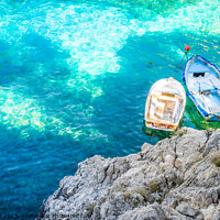 Buy canvas prints of Beautiful view of two rowboats at coast with turqu by Alex Winter
