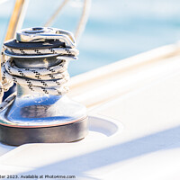 Buy canvas prints of Close-up of winch with nautical rope on boat deck by Alex Winter