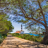 Buy canvas prints of Lighthouse in Porto Colom by Alex Winter