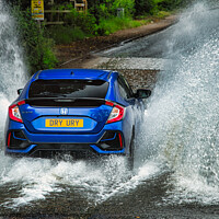 Buy canvas prints of Blue Honda Civic conquers flooded Ford by Martin Day