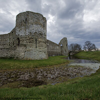 Buy canvas prints of Pevensey Castle under a moody sky by Fiona Etkin